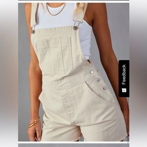 Crème colored overalls with frayed bottom